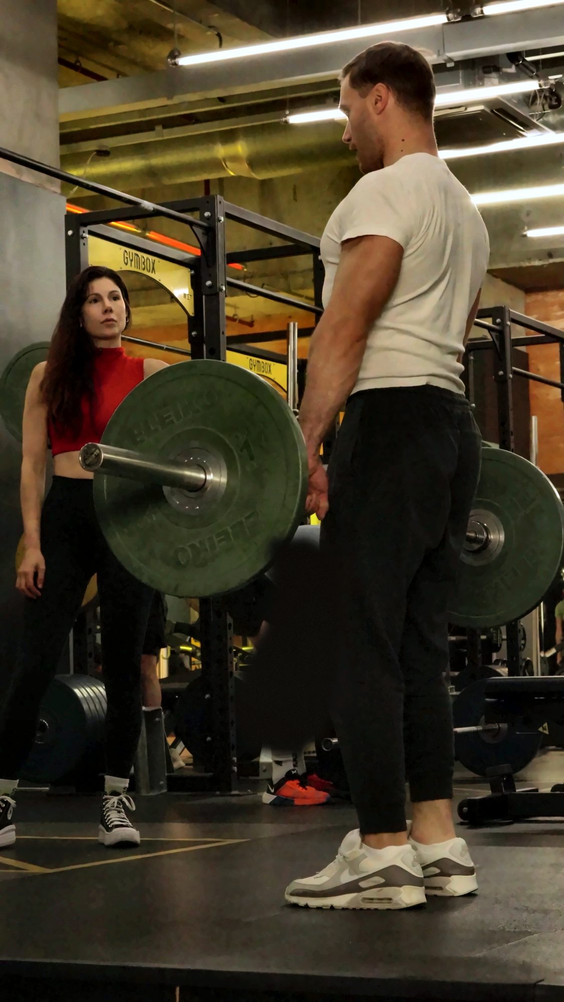 Igor demonstrating deadlift setup for a client